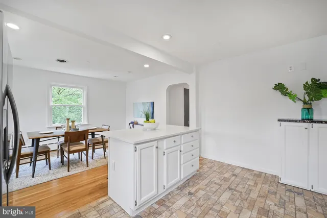 a view of a kitchen and dining room