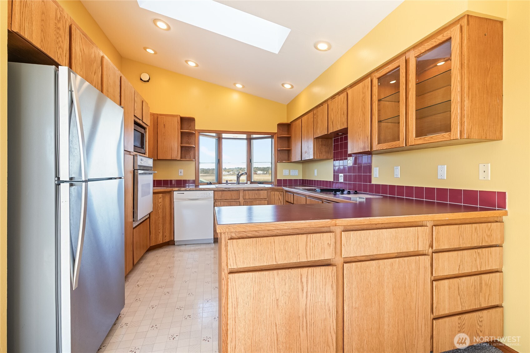 4139 Patos Road Ferndale, WA 98248 - Photo 12 of 39 a kitchen with stainless steel appliances granite countertop a refrigerator a stove and a sink
