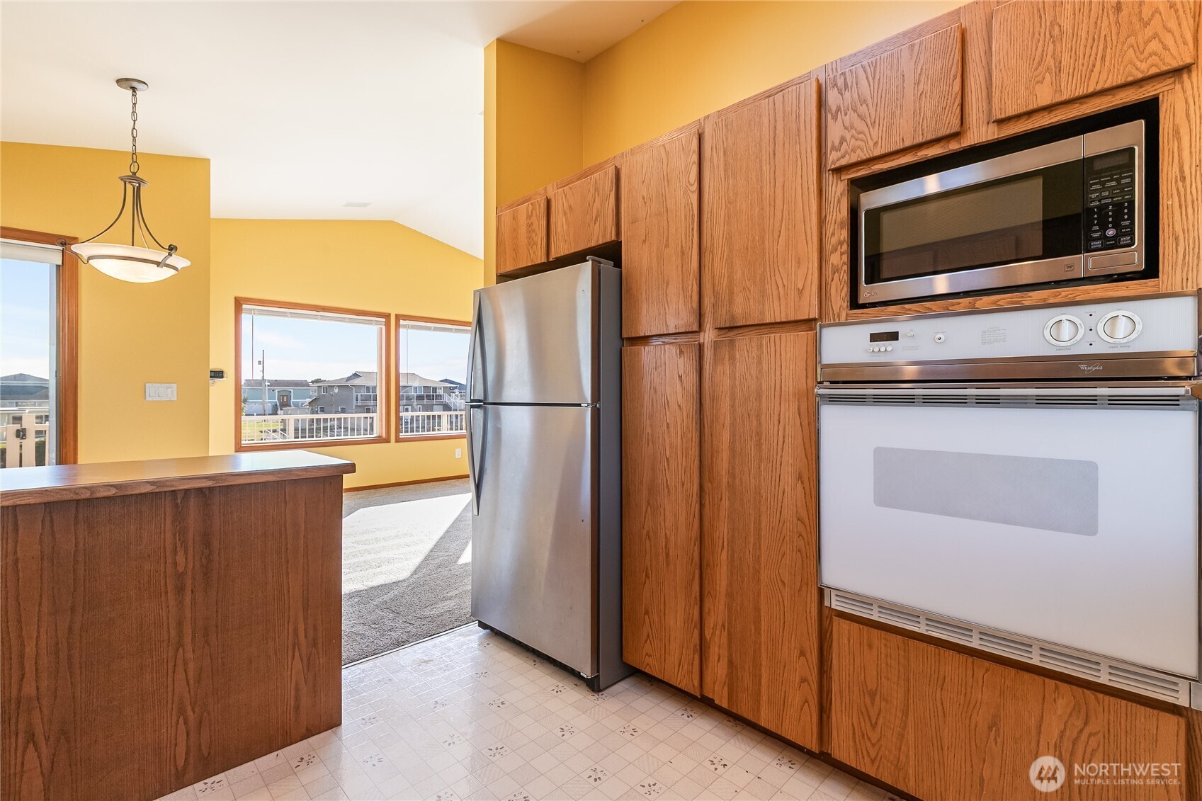 4139 Patos Road Ferndale, WA 98248 - Photo 14 of 39 a kitchen with stainless steel appliances a refrigerator stove and microwave