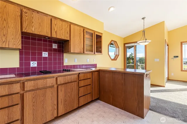 a kitchen with stainless steel appliances granite countertop a sink and a cabinets
