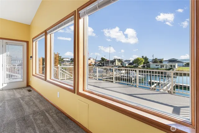 a view of a balcony with wooden floor