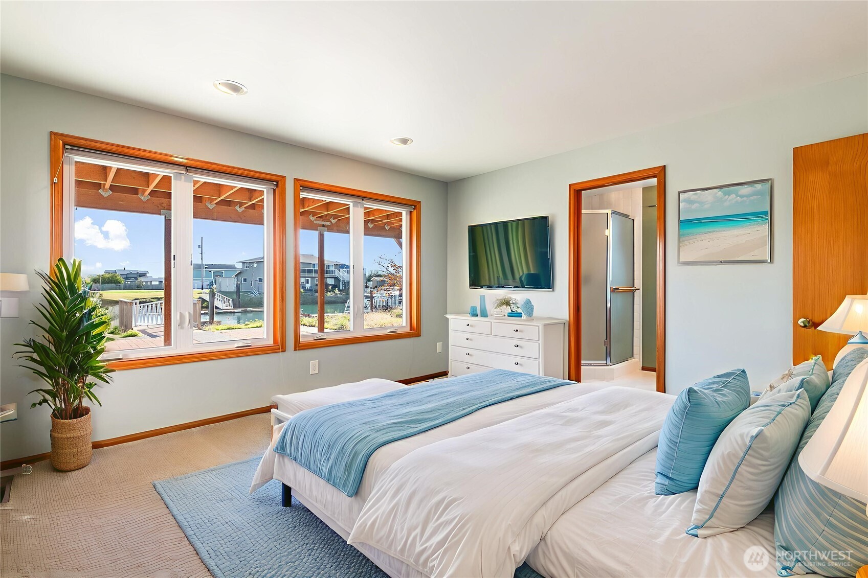 4139 Patos Road Ferndale, WA 98248 - Photo 28 of 39 a bedroom with a large bed and a large window