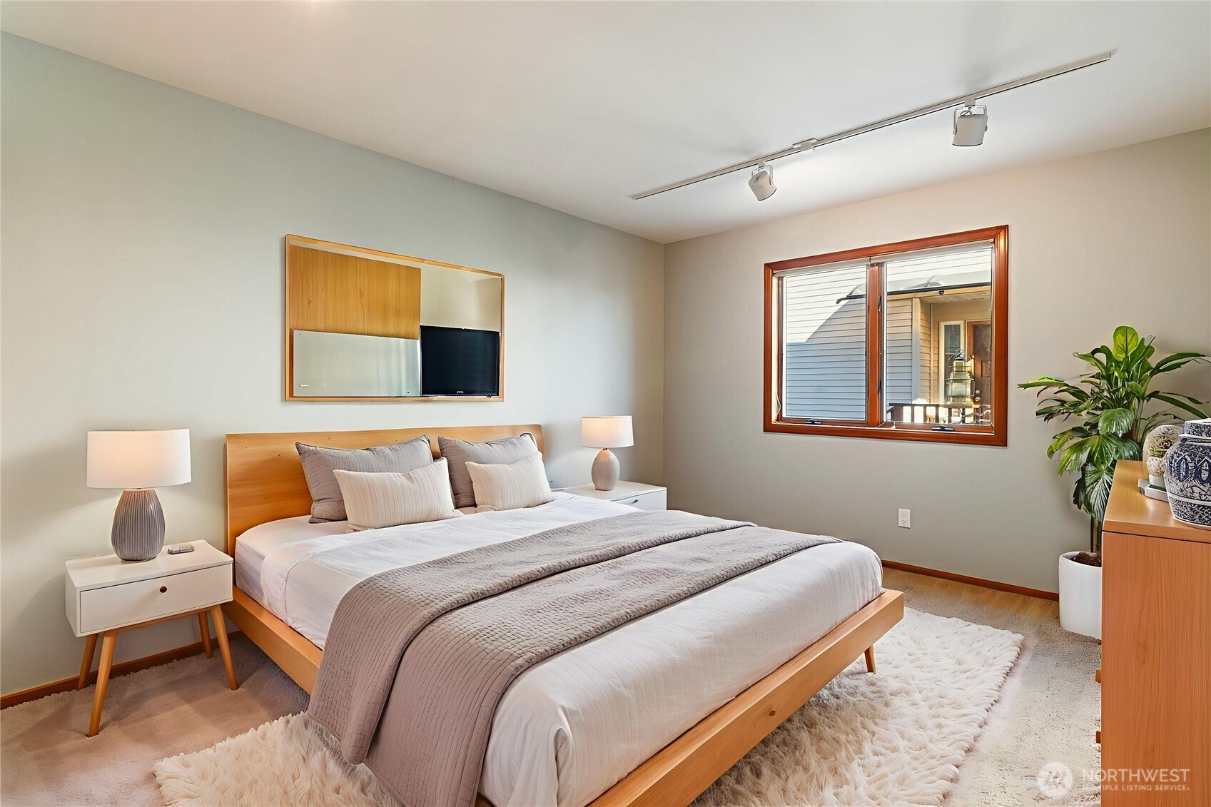 4139 Patos Road Ferndale, WA 98248 - Photo 30 of 39 a bedroom with a bed and a potted plant