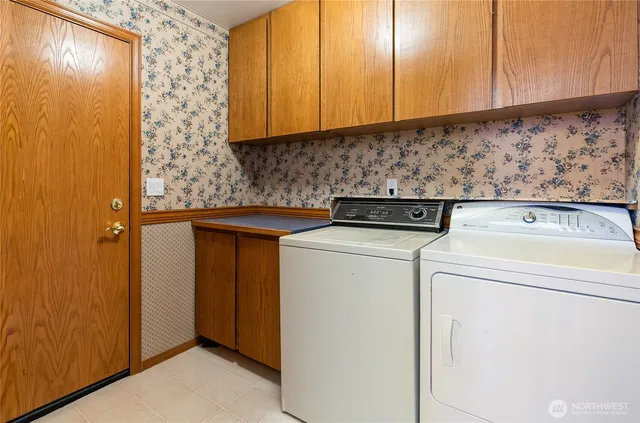 a view of a lake with boats and palm trees