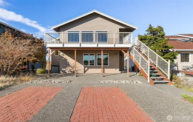 a view of a house with wooden deck