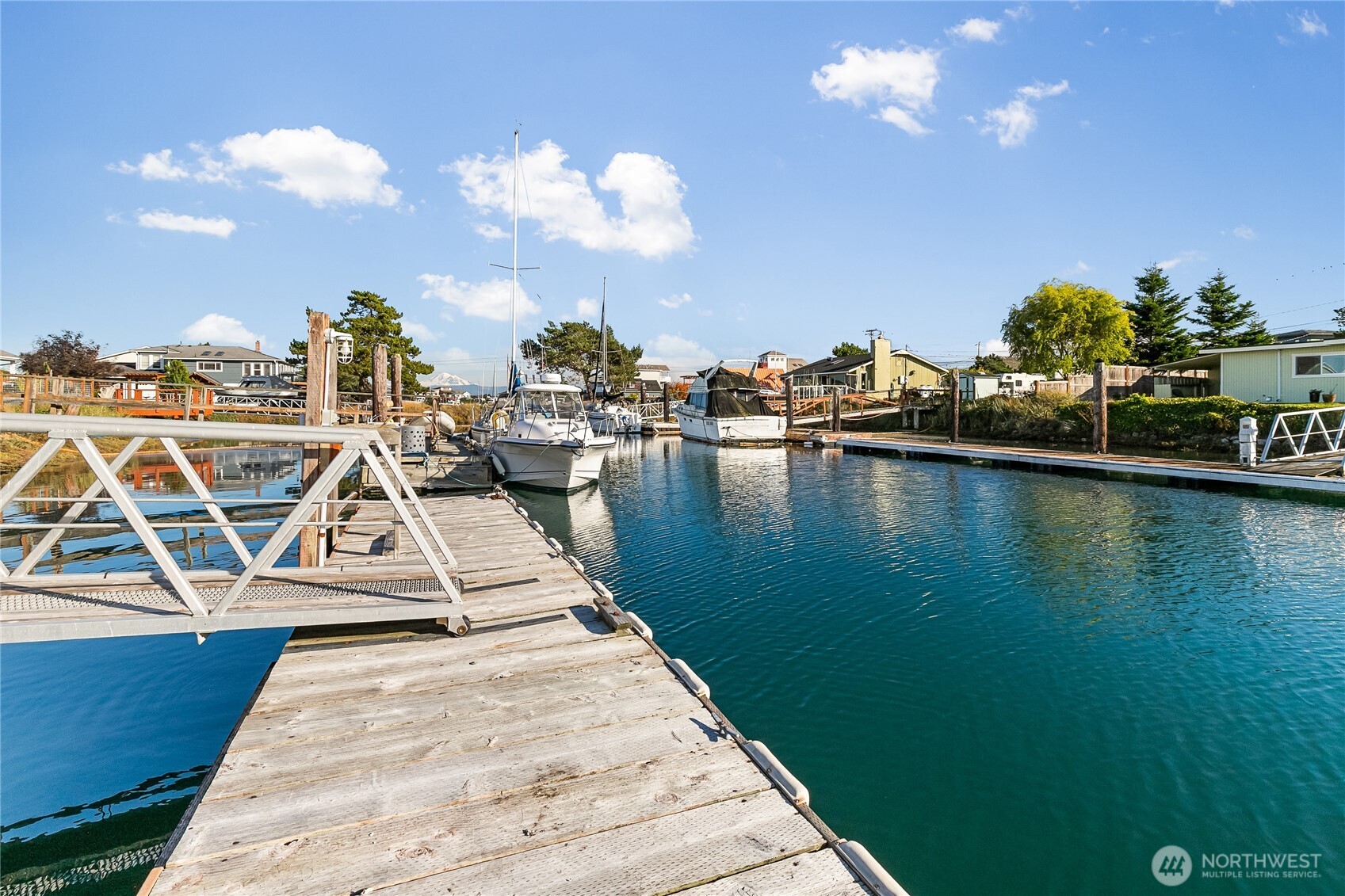 4139 Patos Road Ferndale, WA 98248 - Photo 34 of 39 a view of a lake with boats and palm trees