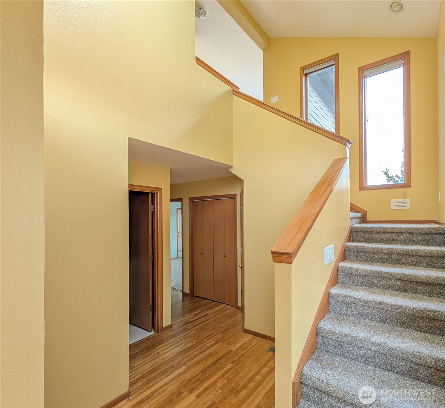 4139 Patos Road Ferndale, WA 98248 - Photo 6 of 39 a view of a hallway with wooden floor and staircase