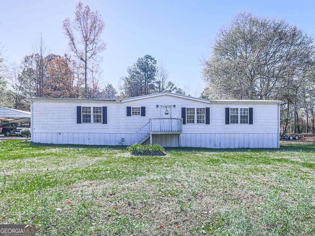 775 Agan Road Bremen, GA 30110 - Photo 1 of 1 a view of a back yard of the house