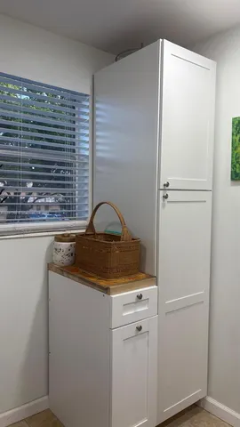 a close view of a sink and washer and dryer