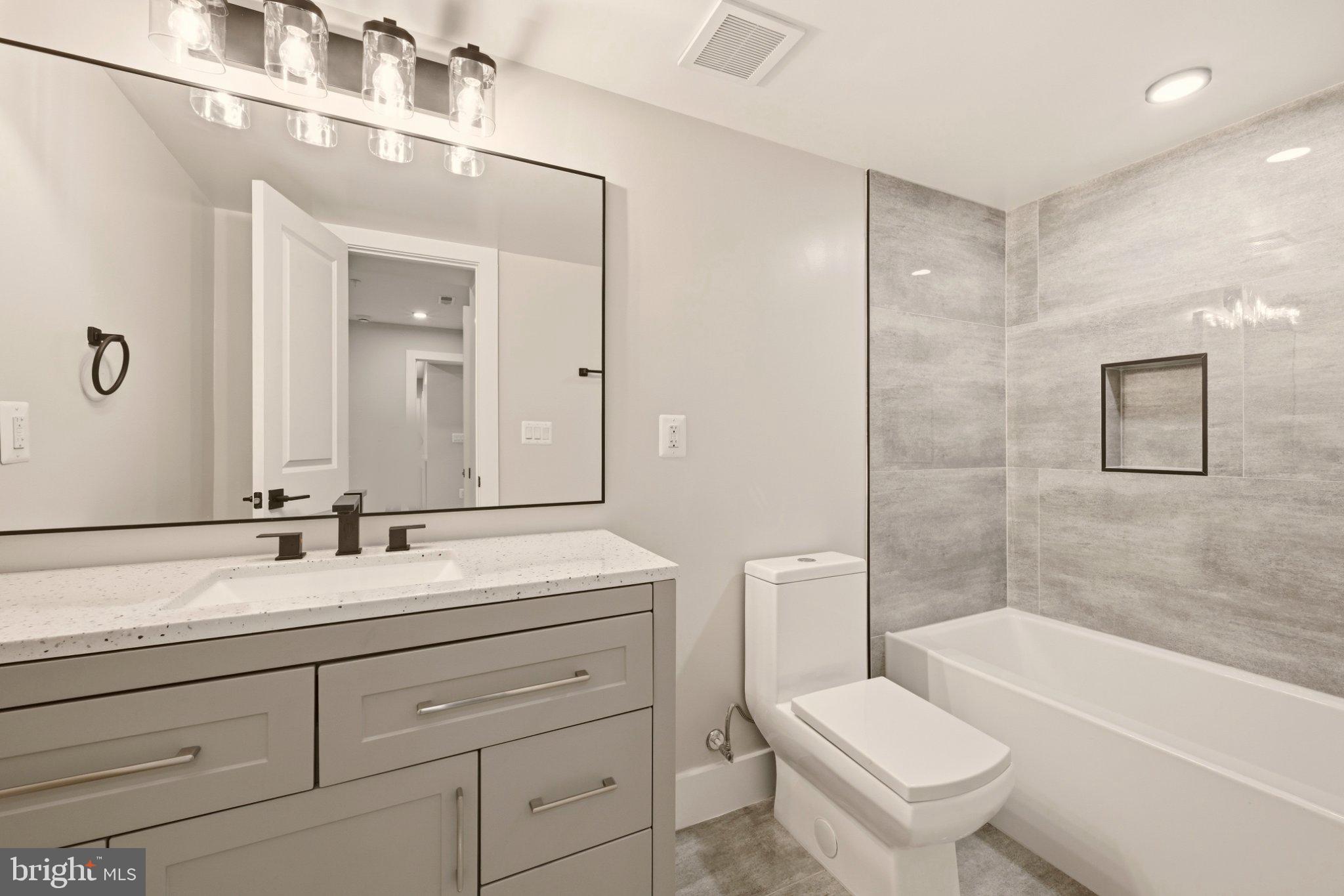 724 Rock Creek Church Road Northwest, Unit B Washington, DC 20010 - Photo 5 of 18 Sleek modern bathroom with elegant finishes.