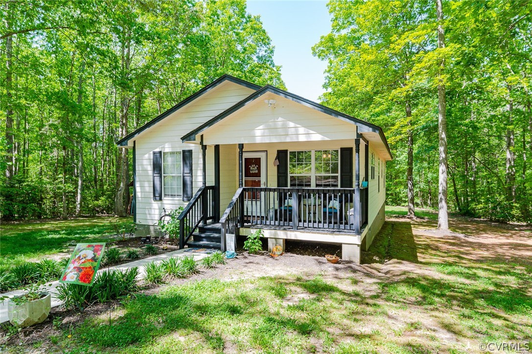 4255 Watson Road Sandy Hook, VA 23153 - Photo 1 of 27 a view of a house with a yard and plants
