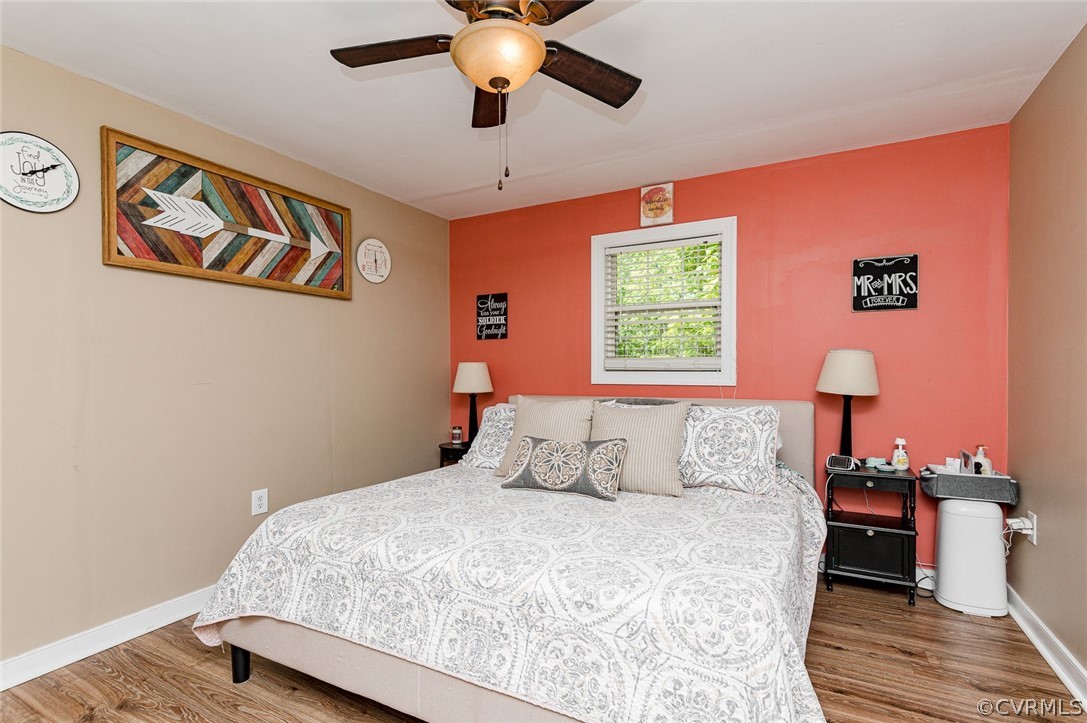 4255 Watson Road Sandy Hook, VA 23153 - Photo 16 of 27 a bedroom with a bed and a window