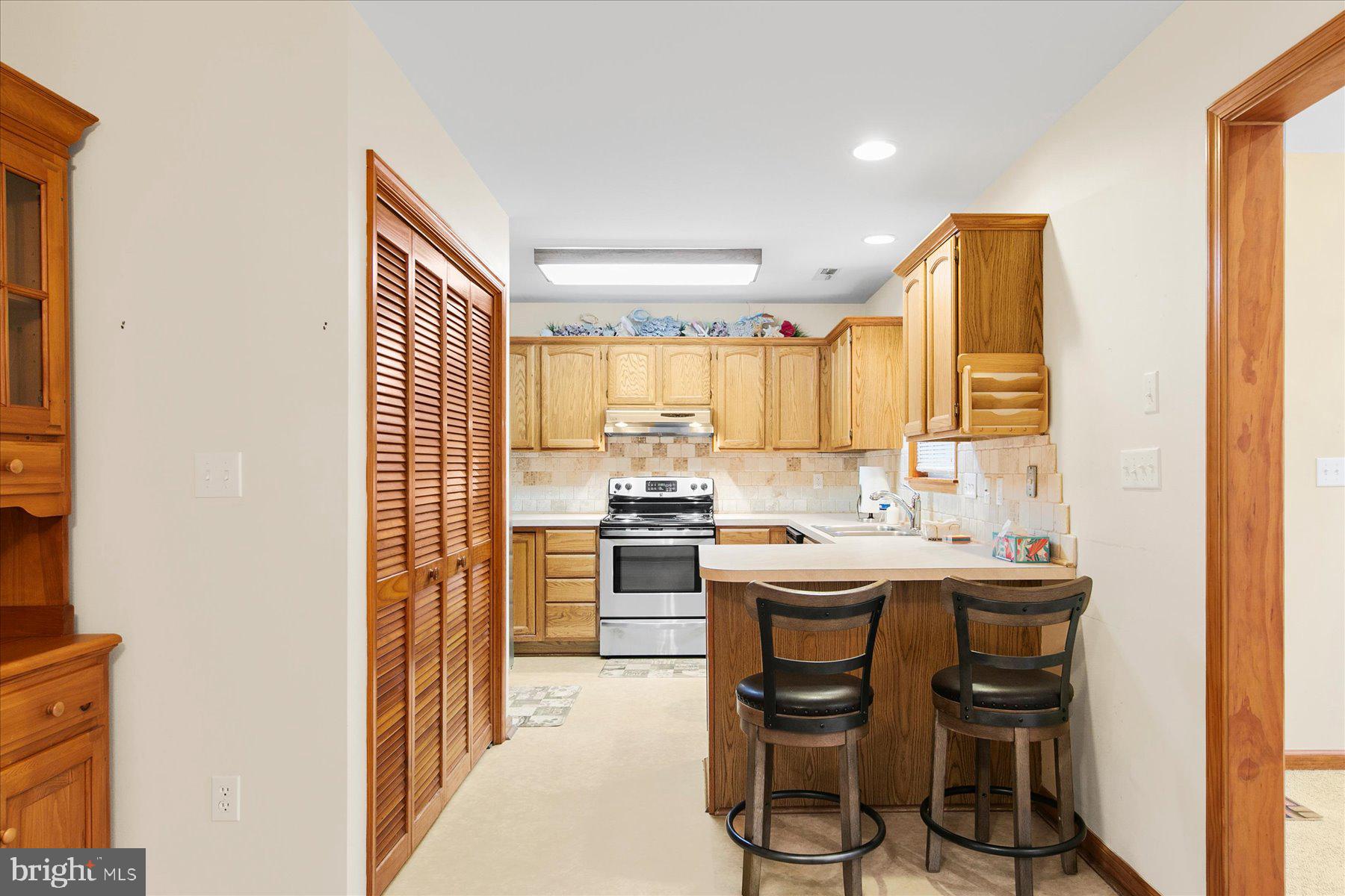 50 King Richard Road Ocean Pines, MD 21811 - Photo 13 of 28 a kitchen with a sink cabinets and counter top space