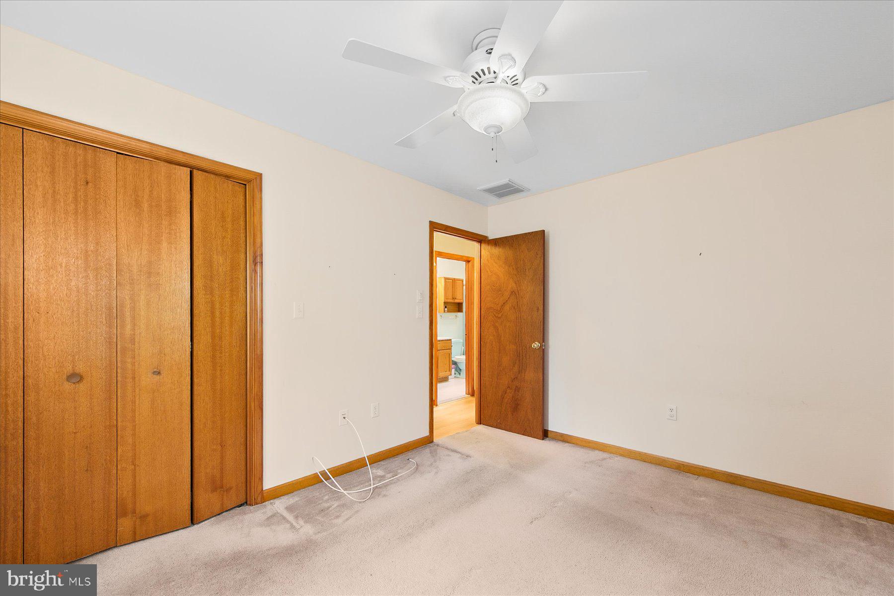 50 King Richard Road Ocean Pines, MD 21811 - Photo 20 of 28 a view of an empty room with a chandelier fan