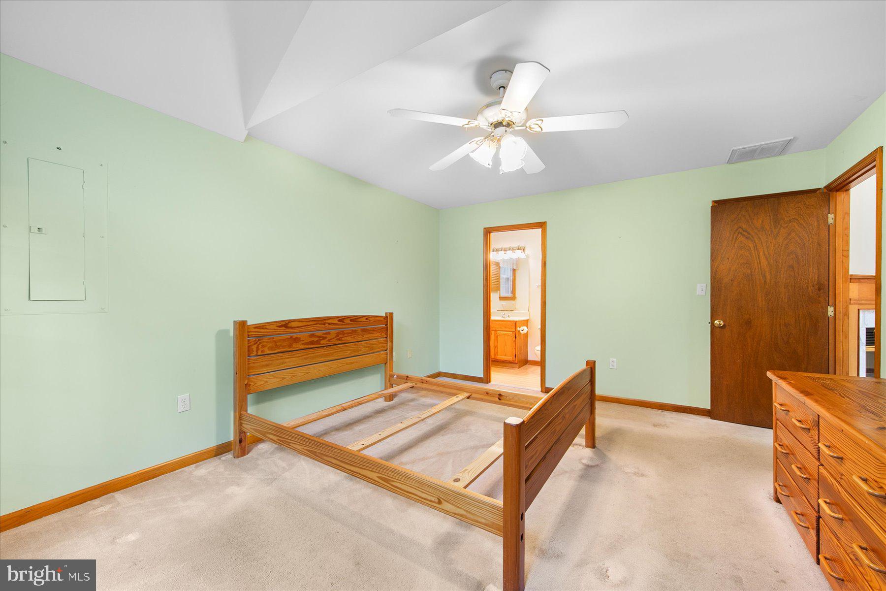 50 King Richard Road Ocean Pines, MD 21811 - Photo 23 of 28 a bedroom with a bed and a chandelier