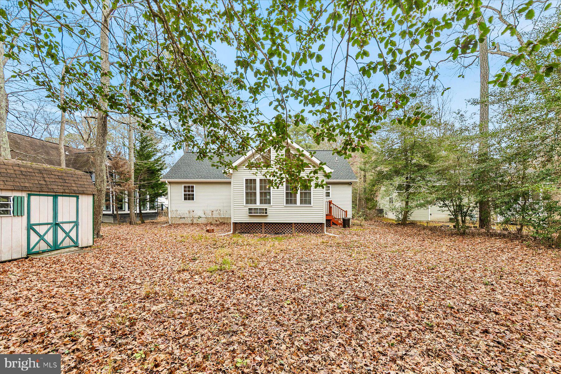 50 King Richard Road Ocean Pines, MD 21811 - Photo 26 of 28 a house covered with tall trees