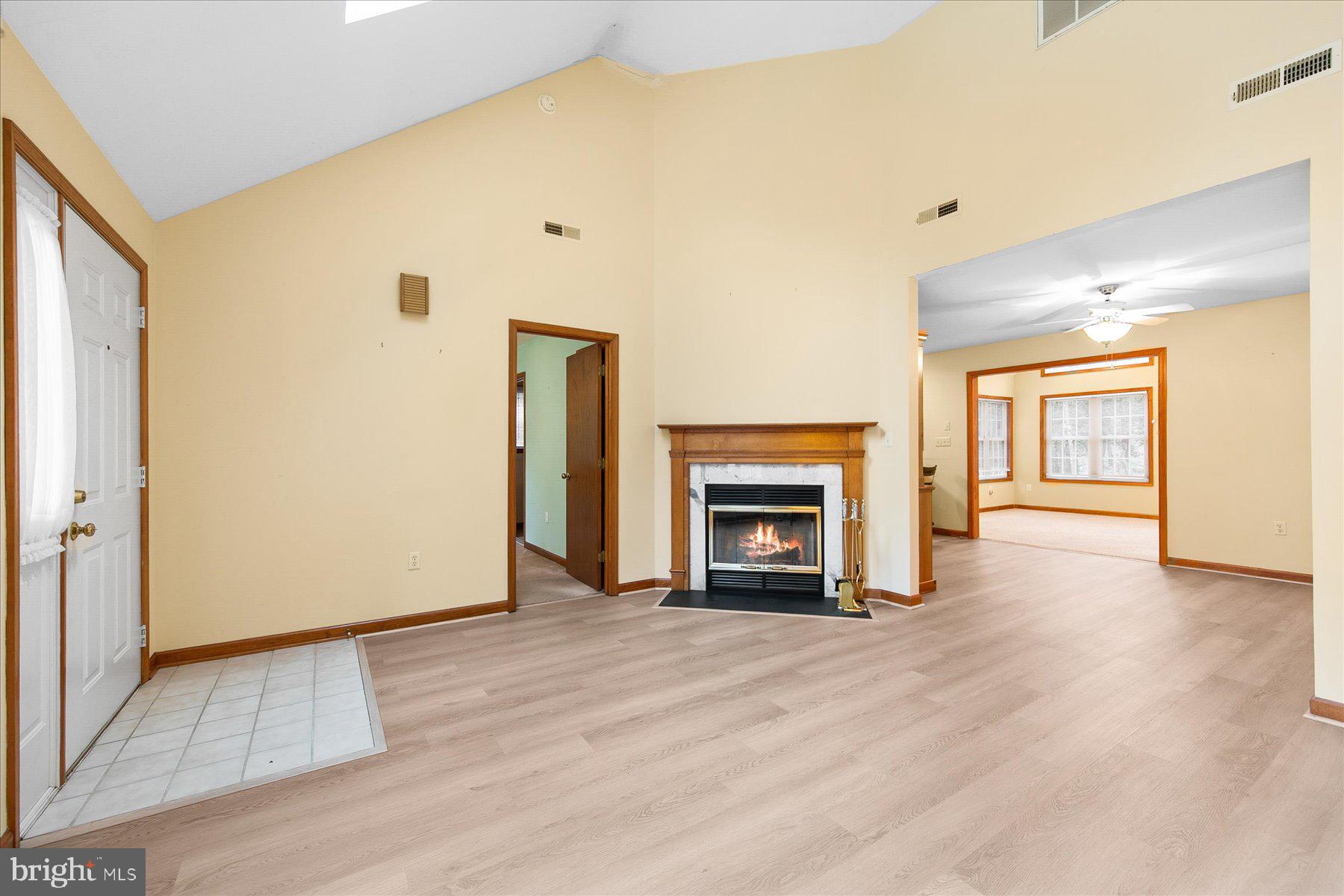 50 King Richard Road Ocean Pines, MD 21811 - Photo 6 of 28 a view of empty room with wooden floor and fireplace
