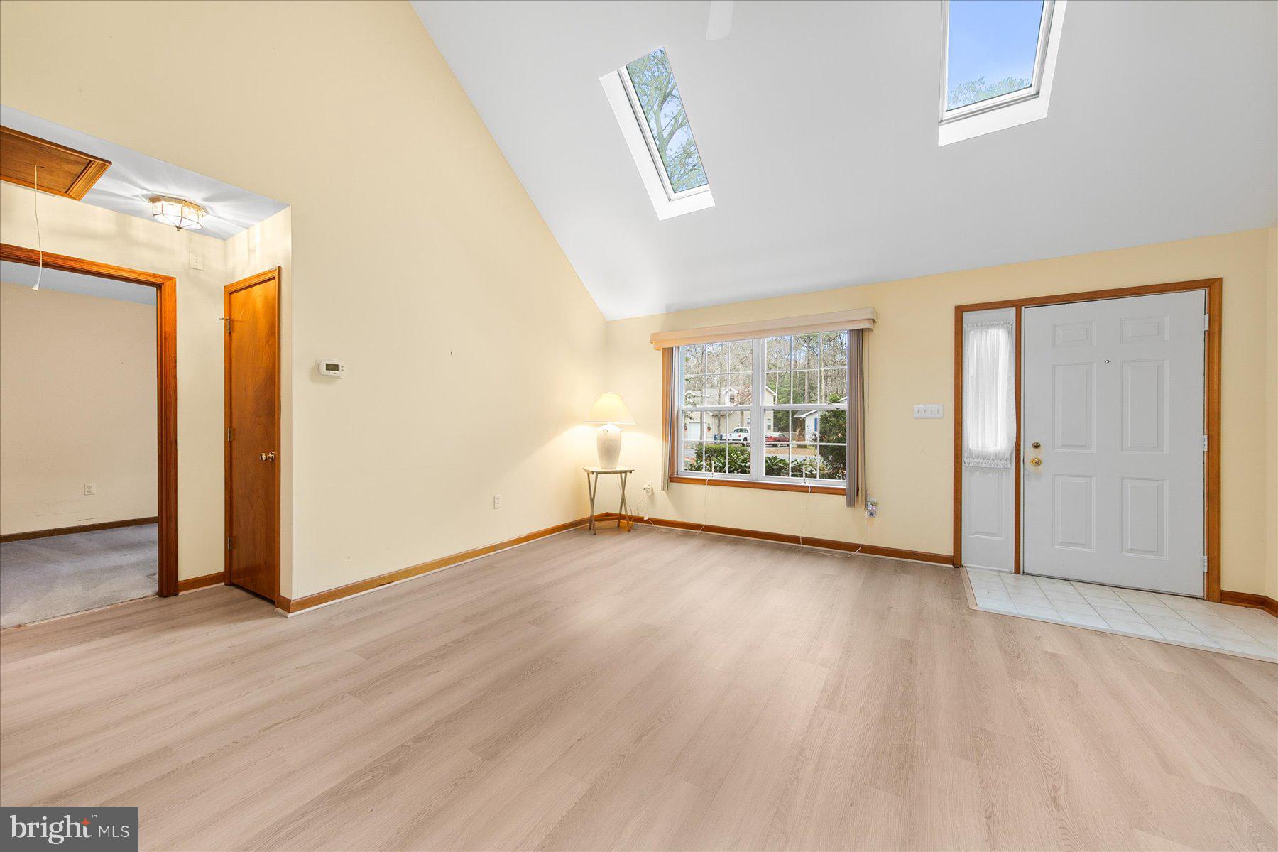 50 King Richard Road Ocean Pines, MD 21811 - Photo 8 of 28 a view of an empty room with wooden floor and a window