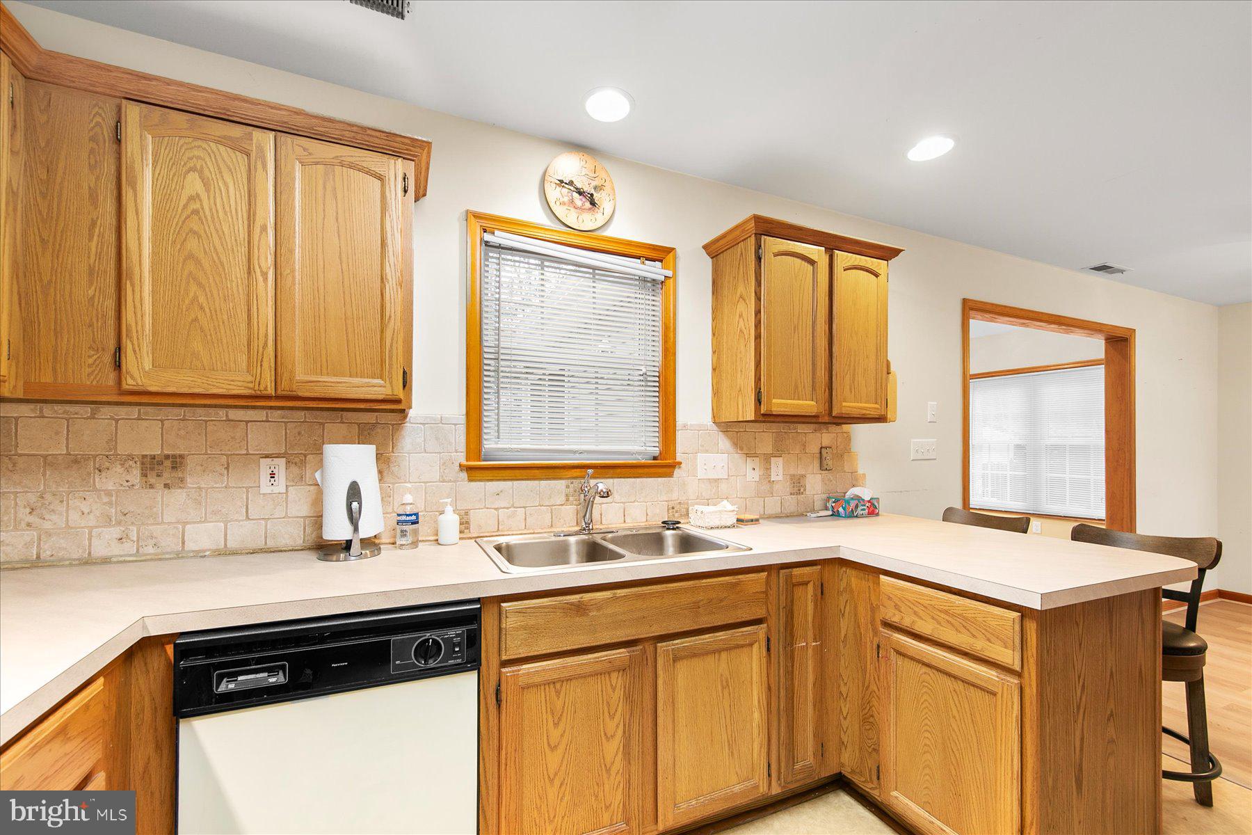 50 King Richard Road Ocean Pines, MD 21811 - Photo 10 of 28 a kitchen with a sink stove and cabinets