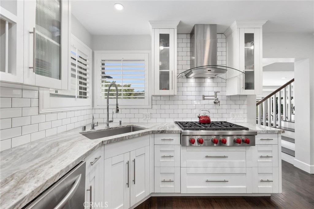714 Avenue D Redondo Beach, CA 90277 - Photo 11 of 47 a kitchen with cabinets a sink and a stove
