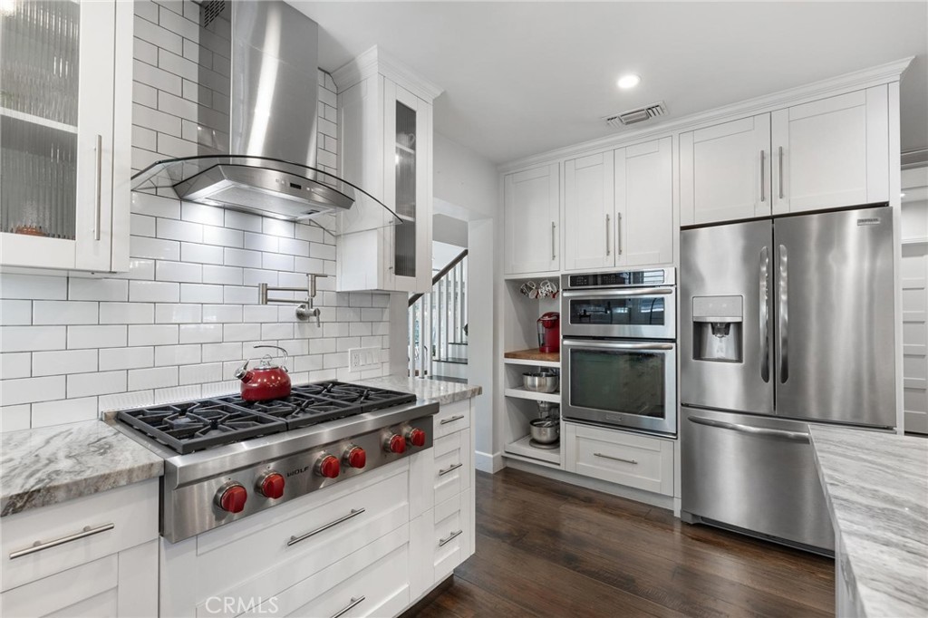 714 Avenue D Redondo Beach, CA 90277 - Photo 12 of 47 a kitchen with stainless steel appliances and wooden floor
