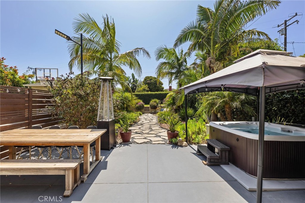714 Avenue D Redondo Beach, CA 90277 - Photo 2 of 47 a view of a patio with a table and chairs under an umbrella