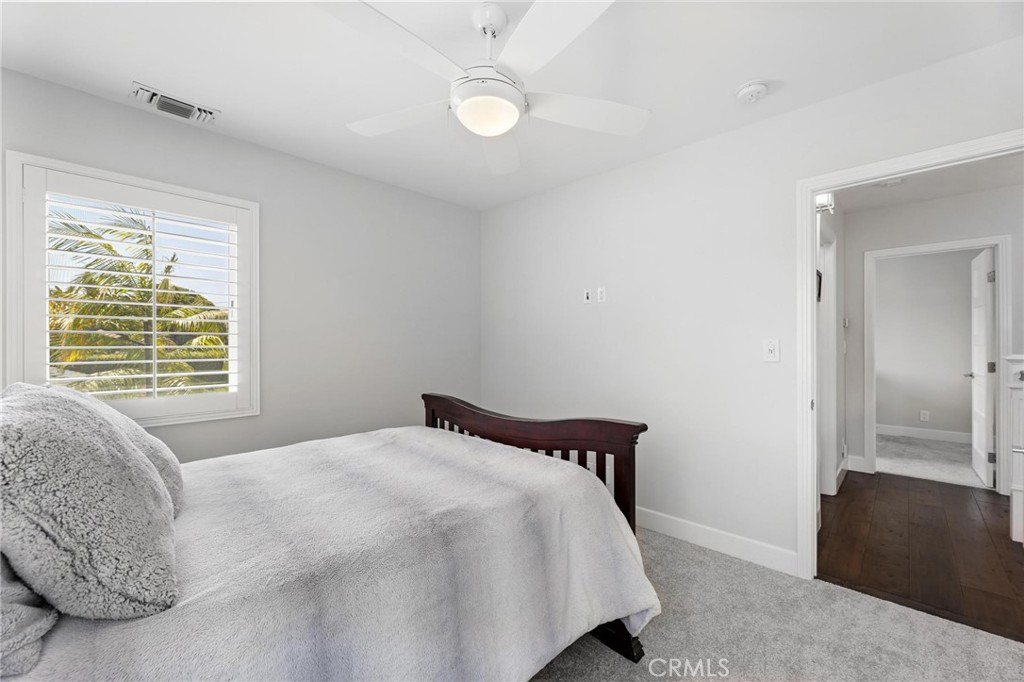 714 Avenue D Redondo Beach, CA 90277 - Photo 34 of 47 a bedroom with a bed and a chandelier
