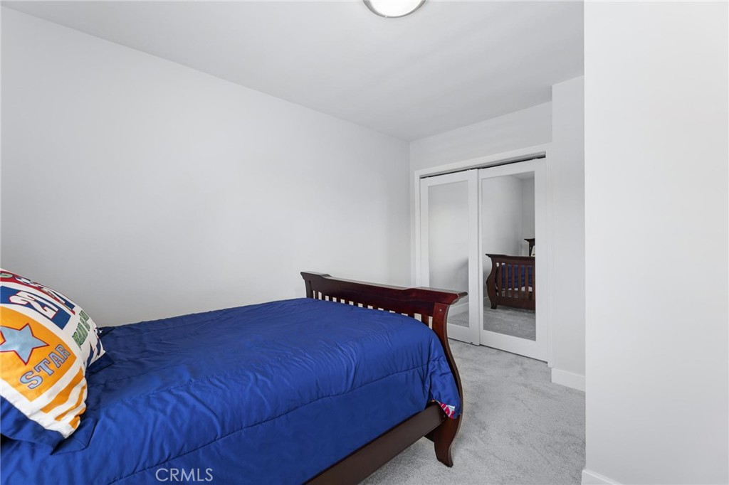 714 Avenue D Redondo Beach, CA 90277 - Photo 37 of 47 a bedroom with a bed and painting on the wall