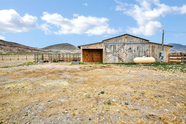 544 East 600 North, Unit 1 Joseph, UT 84739 - Photo 46 of 65 Rustic wooden barn with double doors and an additional side entrance
