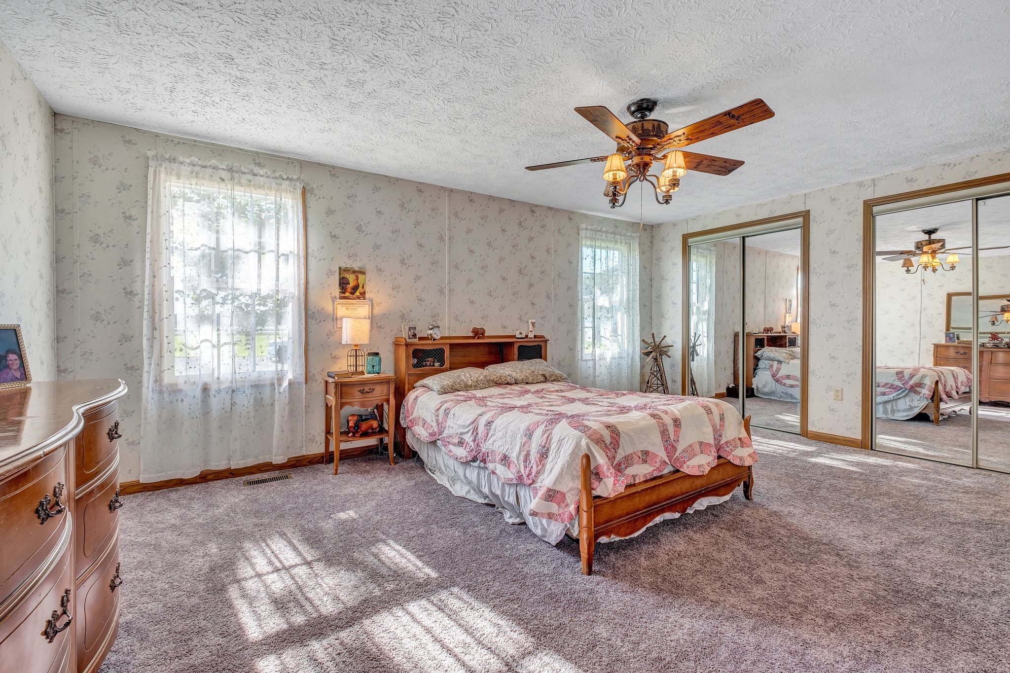 7321 Bethany Church Road Springfield, TN 37172 - Photo 14 of 37 a spacious bedroom with a bed and a chandelier