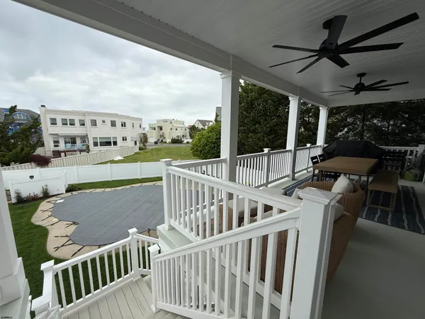 a view of balcony with furniture