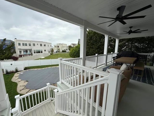 a view of balcony with furniture