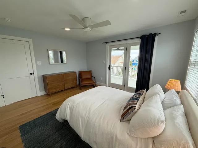 a bedroom with bed and a window