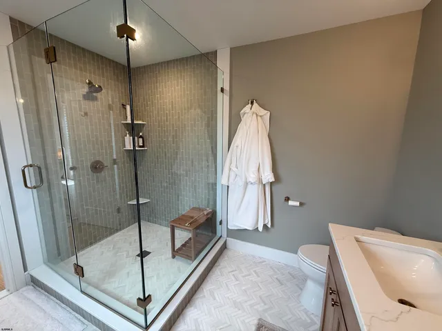 a bathroom with a tub and shower
