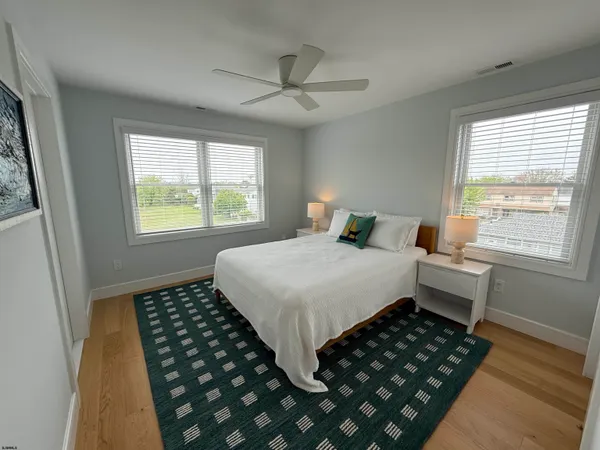 a bedroom with bed and a window