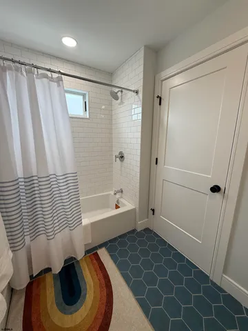 a bathroom with a sink and a shower