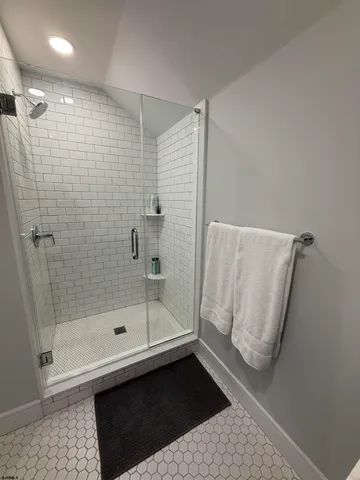 a bathroom with a shower and a toilet
