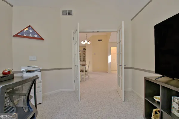 a view of kitchen with furniture and chandelier
