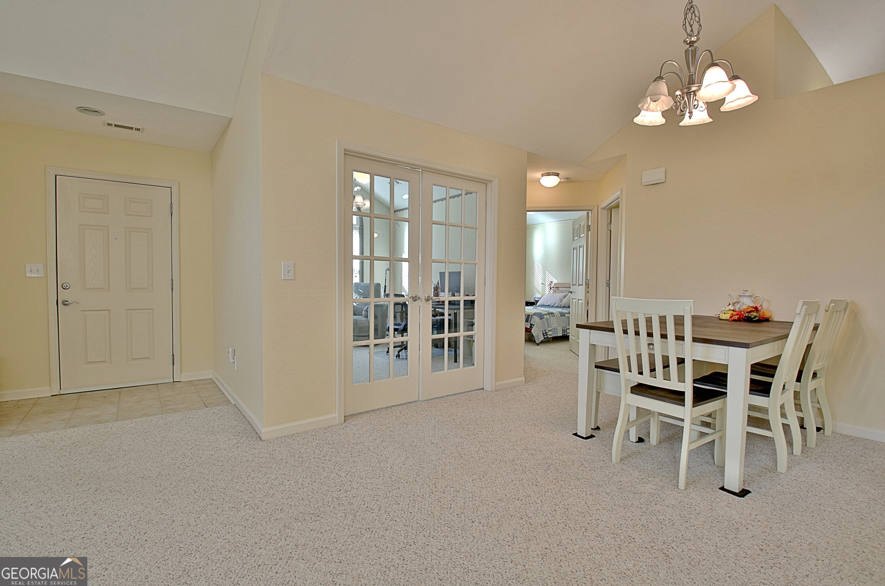 265 Rehobeth Way Fayetteville, GA 30214 - Photo 18 of 63 a dining room with furniture a chandelier and a window