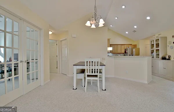a kitchen with stainless steel appliances granite countertop a refrigerator sink and cabinets