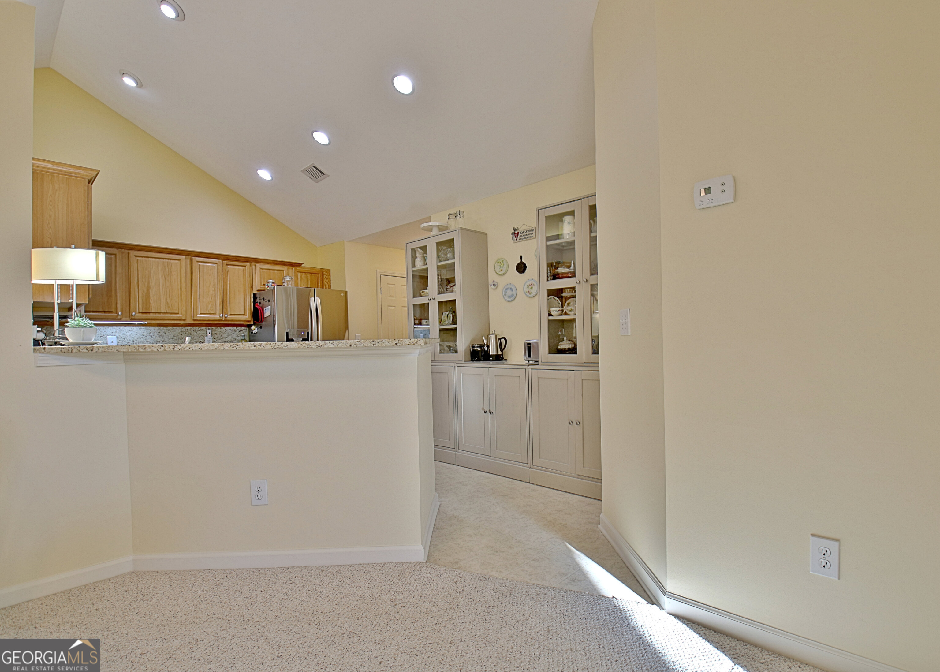 265 Rehobeth Way Fayetteville, GA 30214 - Photo 20 of 63 a kitchen with stainless steel appliances a refrigerator and cabinets