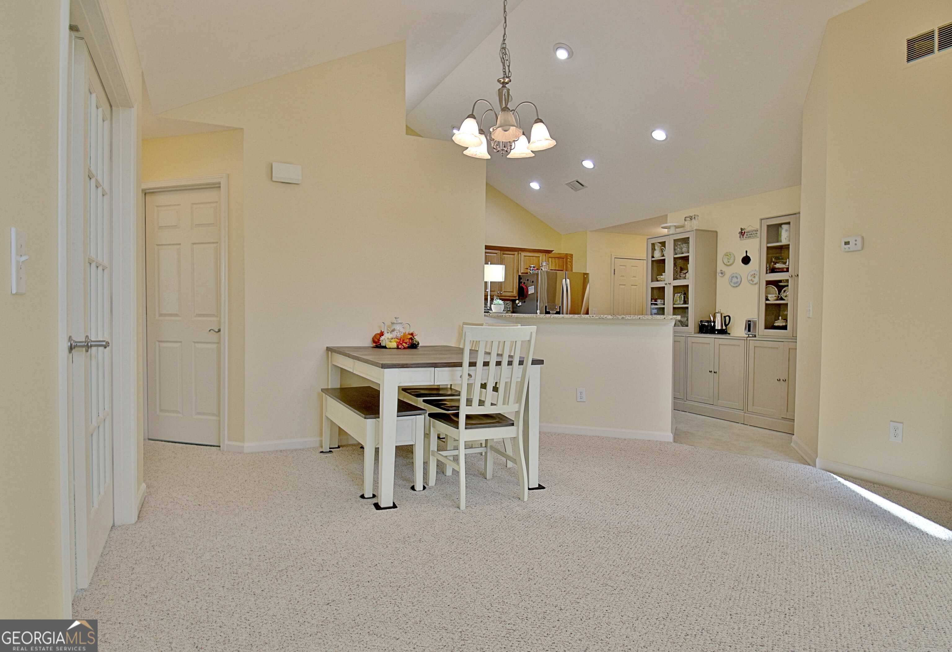 265 Rehobeth Way Fayetteville, GA 30214 - Photo 32 of 63 a view of a dining room with furniture and chandelier