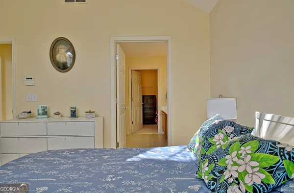 a bedroom with a bed and a table