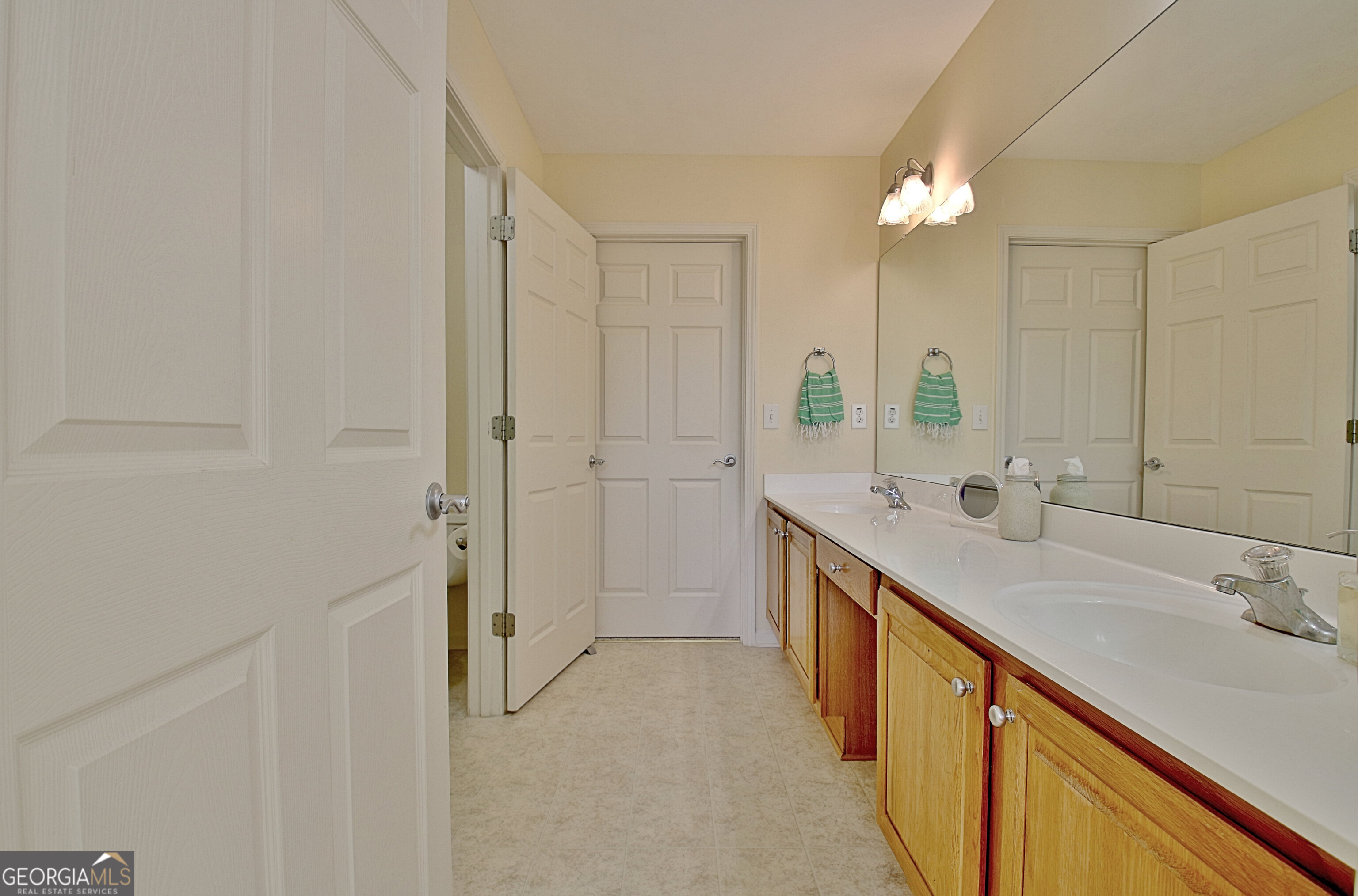 265 Rehobeth Way Fayetteville, GA 30214 - Photo 37 of 63 a bathroom with a double vanity sink mirror and shower