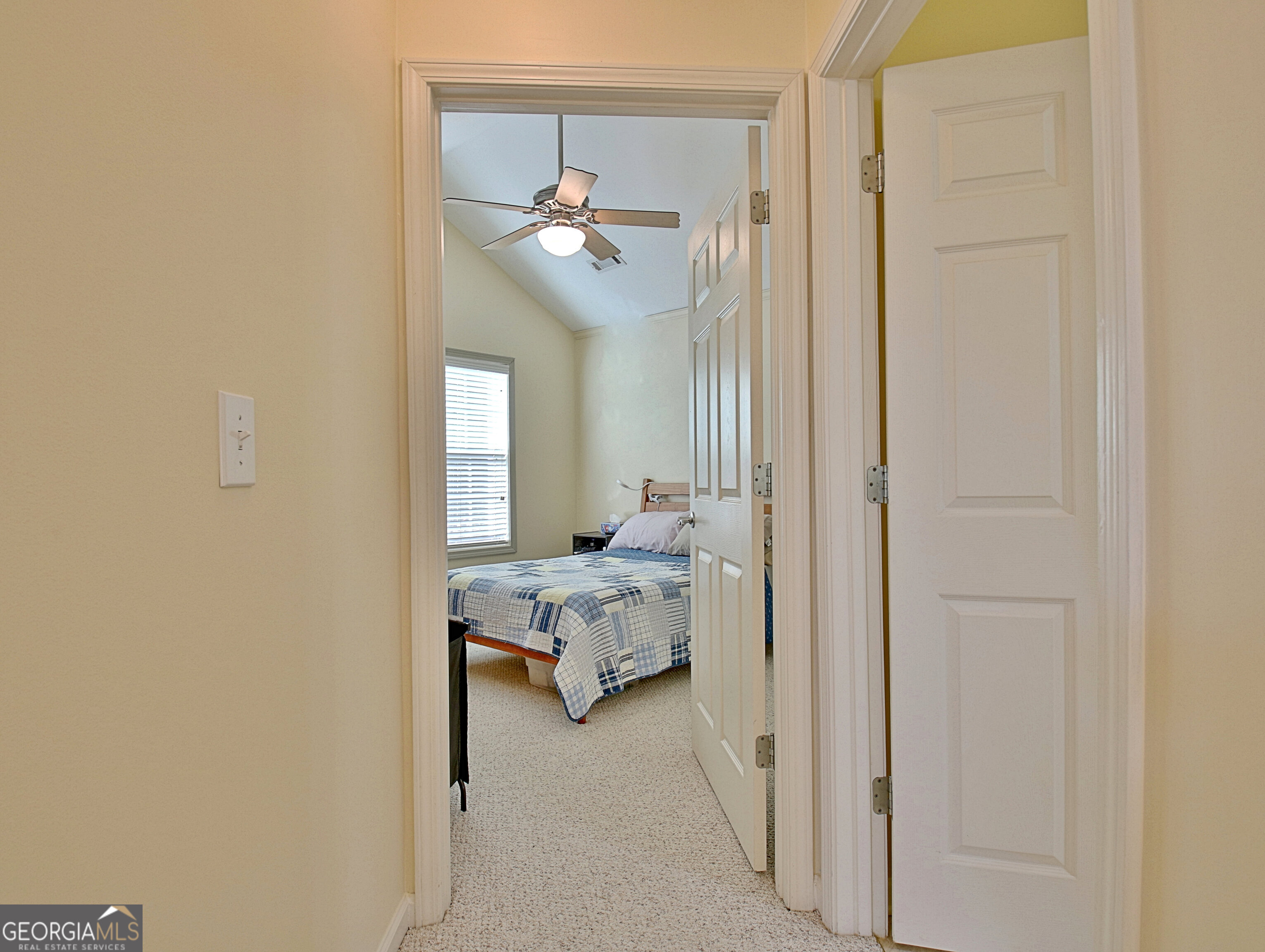 265 Rehobeth Way Fayetteville, GA 30214 - Photo 41 of 63 a bedroom with a bed and a chandelier