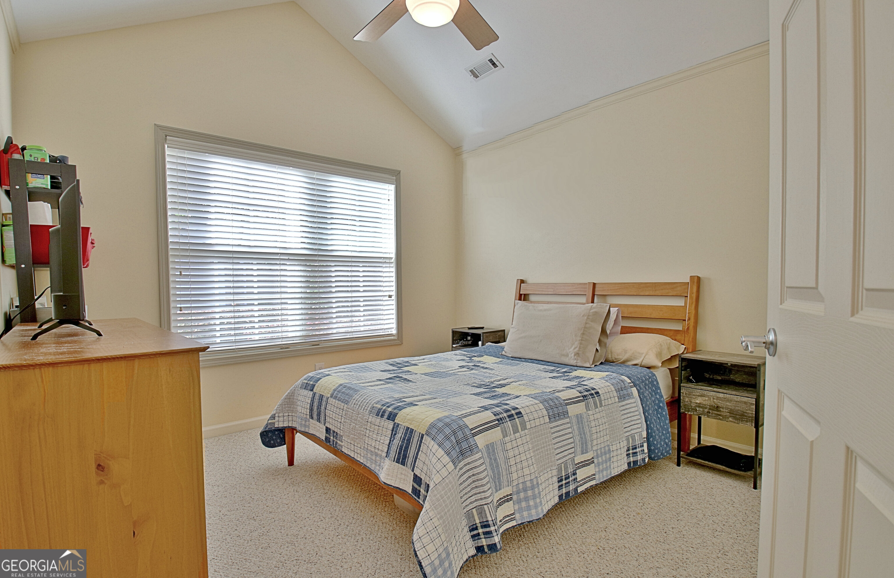 265 Rehobeth Way Fayetteville, GA 30214 - Photo 42 of 63 a bedroom with a bed and a table