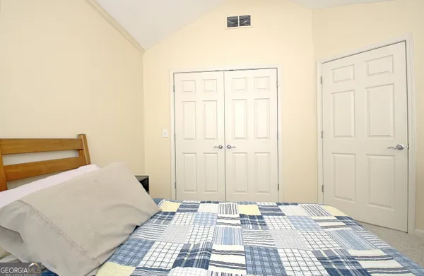 a view of a house with a garden and pathway