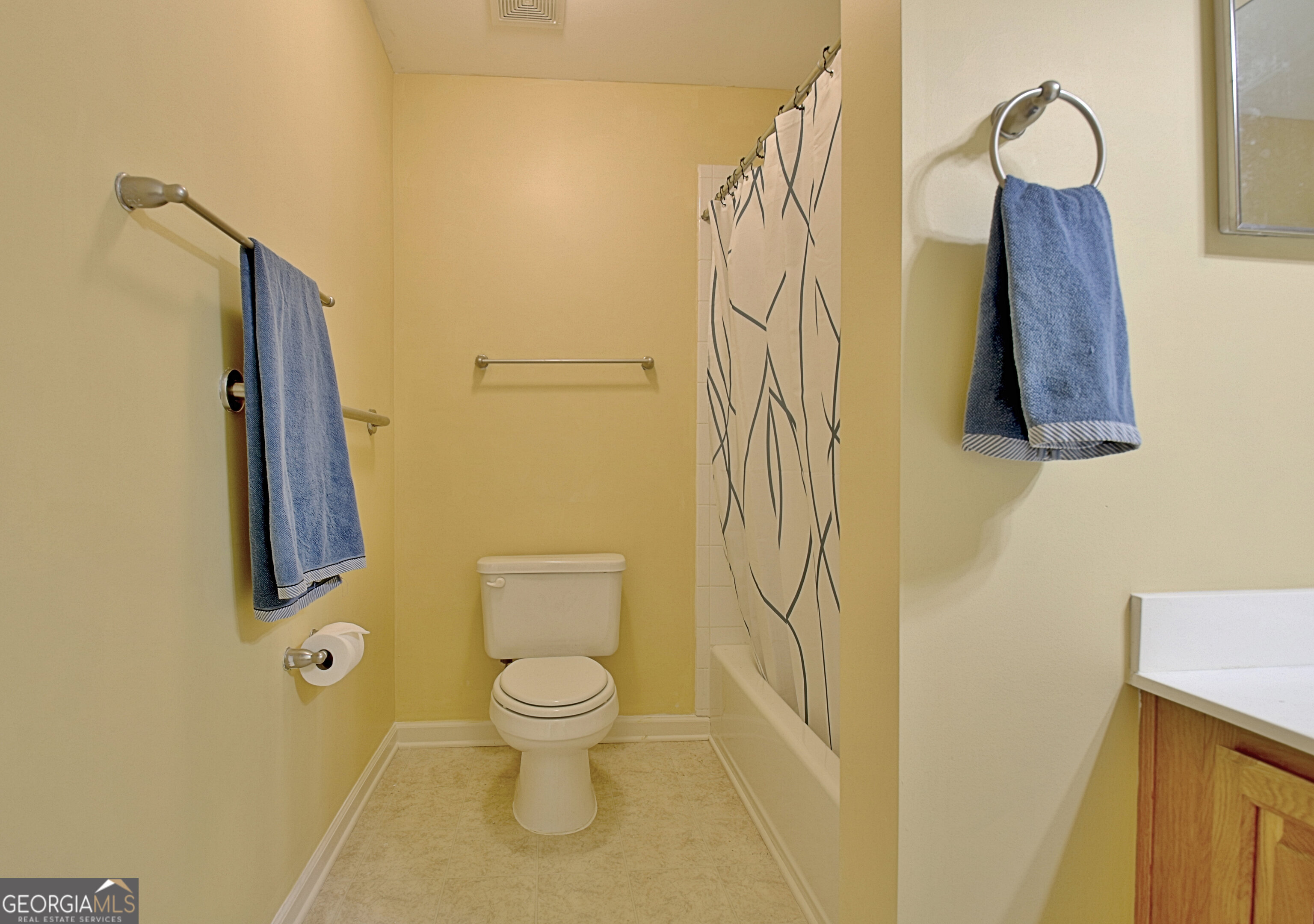 265 Rehobeth Way Fayetteville, GA 30214 - Photo 46 of 63 a white toilet sitting next to a bathroom sink and a shower