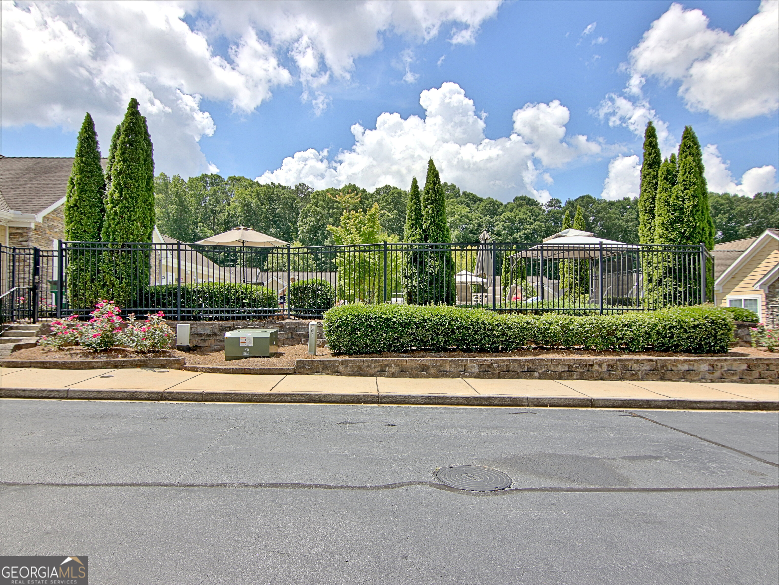 265 Rehobeth Way Fayetteville, GA 30214 - Photo 60 of 63 a front view of a house with a garden and balcony
