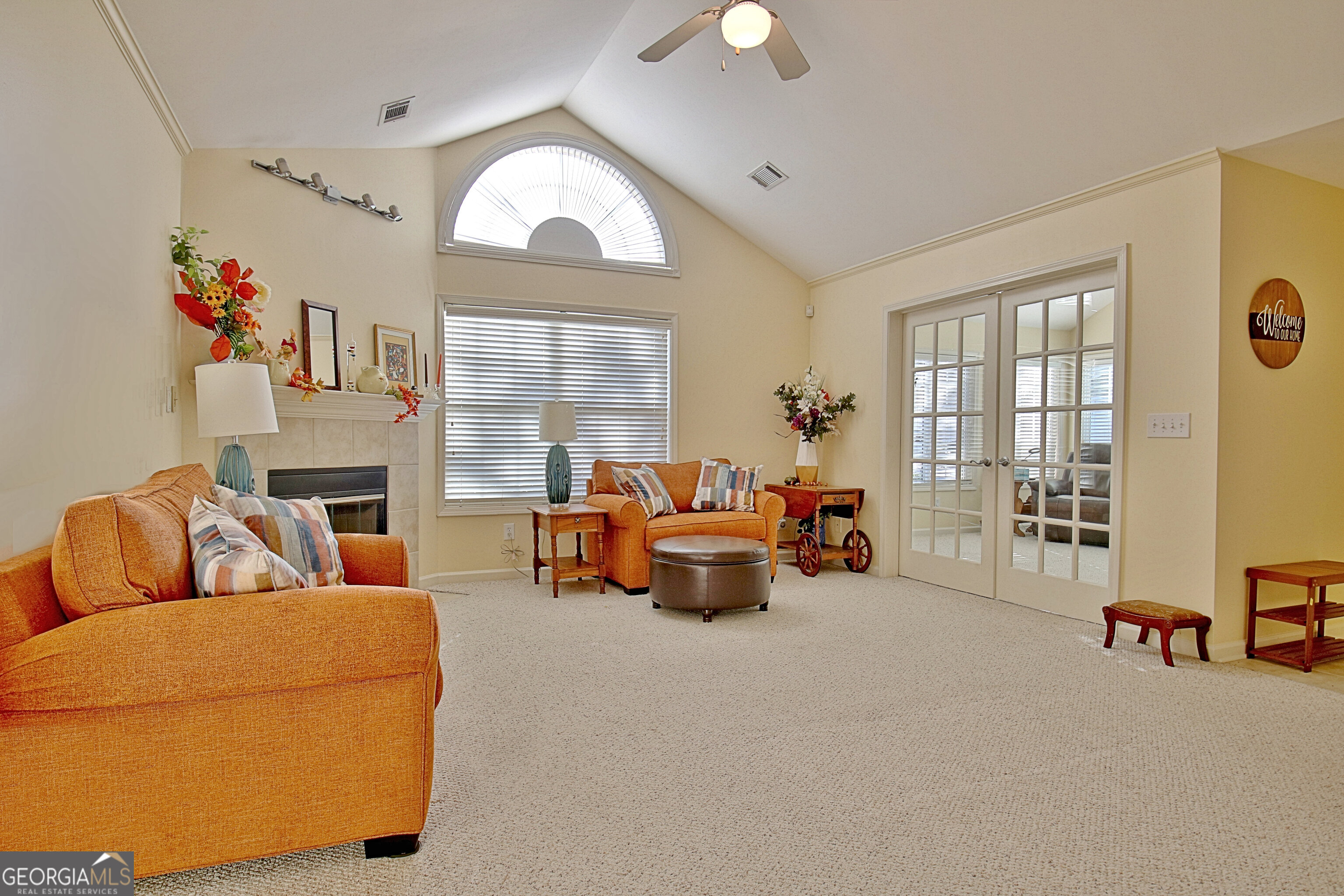265 Rehobeth Way Fayetteville, GA 30214 - Photo 6 of 63 a living room with furniture and a flat screen tv